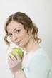 Photo: Woman holding green apple Woman holding green apple