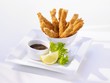 Breaded, deep-fried chicken strips with dip