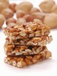 Stacked bars of almond and peanut brittle