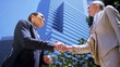 Young females shaking hands