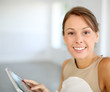 Portrait of beautiful woman using tablet