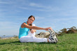 Young woman doing stretching exercises outside