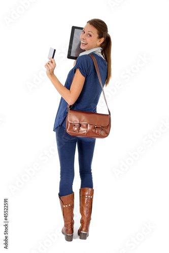 Photo: Shopping girl using tablet and credit card Shopping girl using tablet and credit card