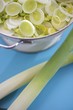 Leek rings in bowl, leeks in front