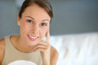 Portrait of attractive woman sitting in couch