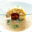 Frothy soup with a prawn and tomato kebab