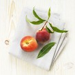 Organic peaches on linen cloth