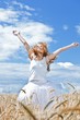 Young woman in barley field