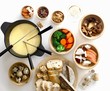 Cheese fondue with vegetables, mushrooms, bread