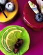 Assorted petit fours with blueberries and lime