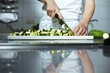 Chef chopping courgettes