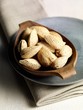 Almonds in wooden bowl