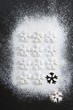 Christmas biscuits with icing sugar (overhead view)