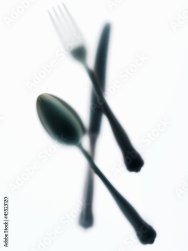 Photo: Knife, fork and spoon, blurry Knife, fork and spoon, blurry