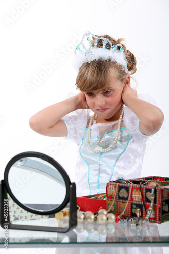 Photo: Young girl playing dress-up Young girl playing dress-up