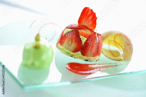 Photo: A strawberry tartlet with pistachio ice cream A strawberry tartlet with pistachio ice cream