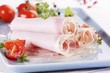 Rolls of ham in aspic with tomatoes