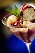 Ice Cream Sundae with Berry Sauce in a Stem Glass