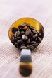 Roast coffee beans in a spoon