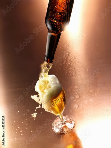 Photo: Beer being poured into a glass Beer being poured into a glass
