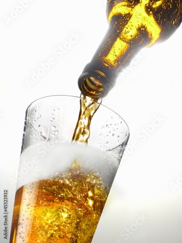 Photo: Beer being poured into a glass Beer being poured into a glass