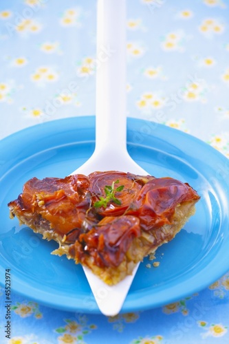 Photo: A slice of tomato tart on a cake slice A slice of tomato tart on a cake slice