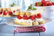 A layered dessert made of sponge fingers, cream and berries