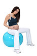 Pregnant woman bouncing on a birth ball