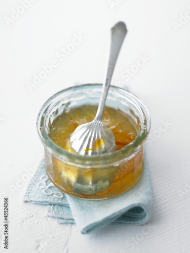 Photo: Orange marmalade in a glass dish with a spoon Orange marmalade in a glass dish with a spoon