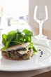 Sea bass on a bed of vegetables with water cress