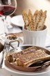 Roasted Marrow Bones; Grilled Bread Slices and a Glass of Wine