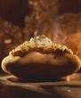 A Steaming Baked Potato with Sour Cream and Chives