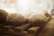 Bread rolls on a wooden rack