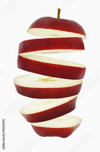Photo: Flying slices of red apple Flying slices of red apple