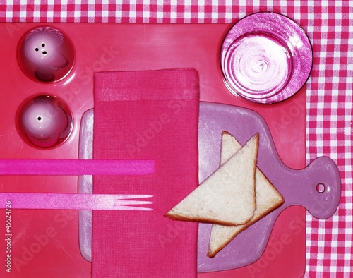 Photo: A pink place setting with toast triangles A pink place setting with toast triangles