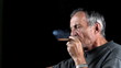 Smokes cigar