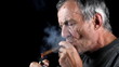 Man smokes  cigar