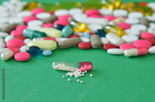 Photo: Drug on green background Drug on green background