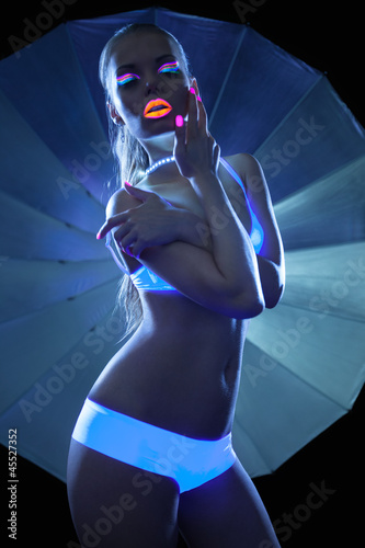 Photo: Girl with ultraviolet make-up disco dance Girl with ultraviolet make-up disco dance