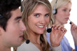 three employees holding headsets