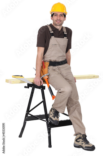 Photo: Carpenter leaning against workmate Carpenter leaning against workmate