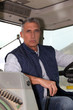 Farmer in the cab of his tractor