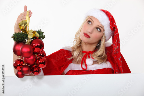 Photo: Mrs. Santa is in charge of Christmas decorations Mrs. Santa is in charge of Christmas decorations
