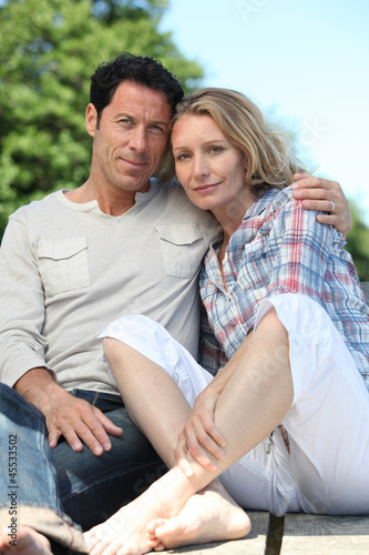 Photo: Couple sitting outside Couple sitting outside