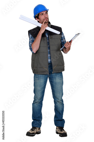 Photo: Tradesman weighing his options Tradesman weighing his options