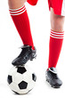 Foot in the red socks, and black shoes standing on a football
