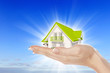 the house in hands on blue sky