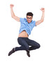 young casual man jumping and shouting
