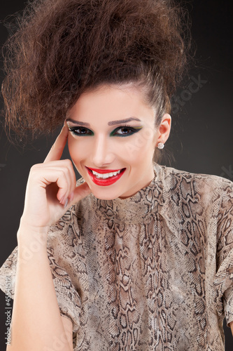 Photo: woman in a snake leather blouse woman in a snake leather blouse