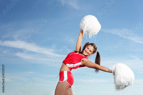 Photo: Young female cheerleader Young female cheerleader